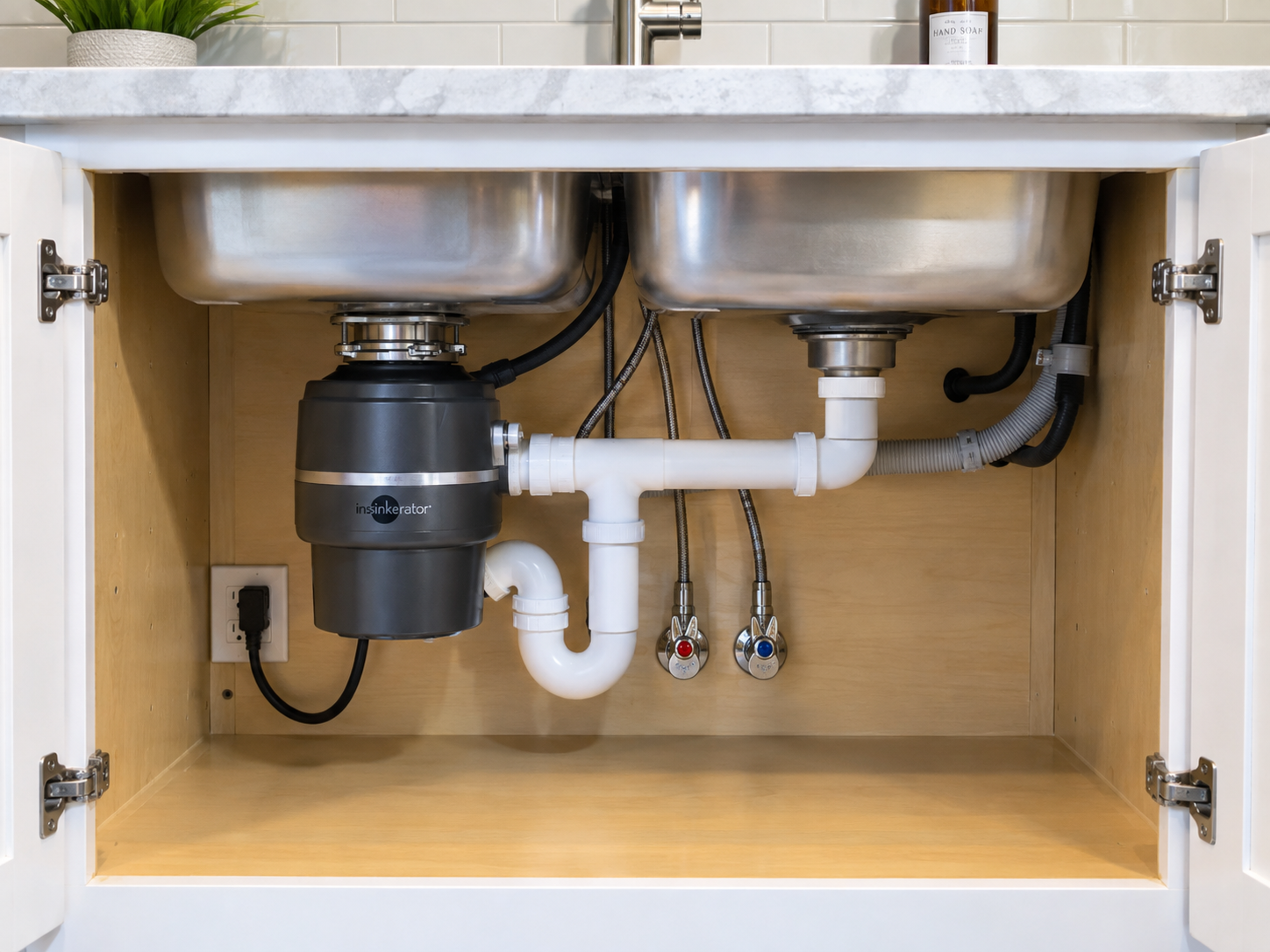 Placeholder example of a finished under-sink drain and garbage disposal installation