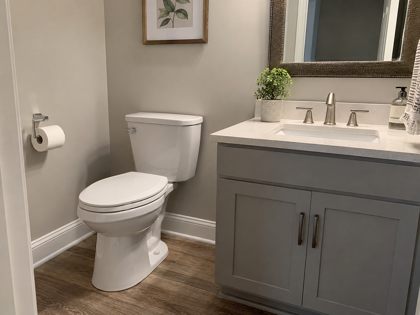 Placeholder example of a completed toilet, vanity, and bathroom fixture installation